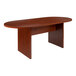 A Flash Furniture Lake Cherry oval conference table with a wooden top.