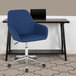 A blue Flash Furniture office chair with wheels next to a desk.