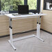 A Flash Furniture Fairway white desk with a laptop on it.