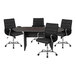 A black oval conference table with four black leather chairs around it.