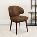 A brown Flash Furniture Comfort walnut microfiber side chair with wooden legs in a room.