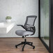 A Flash Furniture Kelista mid-back office chair with a gray seat and black back.