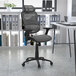 A Flash Furniture gray mesh office chair with black armrests and base.