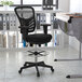 A Flash Furniture black mesh mid-back office chair with an adjustable foot ring and black frame.