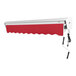 A red Awntech retractable patio awning with a protective hood over a white wall.