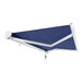 A navy blue and white Key West retractable patio awning with white poles.