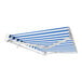 An Awntech Destin blue and white striped awning on a white wall.