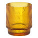 An Acopa Lore amber rocks glass with a striped pattern.