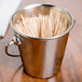 An American Metalcraft stainless steel mini pail filled with toothpicks.