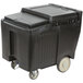 A black plastic container with wheels and a sliding lid.