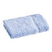 A blue Fibertone washcloth on a white background.