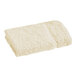 A beige 1888 Mills Fibertone cotton/polyester washcloth folded on a white background.