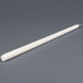 A 15 inch ivory Will & Baumer taper candle.