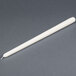A 15" ivory Will & Baumer taper candle in a white wrapper on a gray surface.