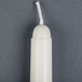 A white cylindrical Will & Baumer taper candle.