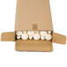 A cardboard box of Will & Baumer ivory taper candles.