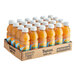 A cardboard box filled with Tropicana Orange Juice bottles.