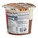 A Quaker Maple and Brown Sugar Instant Oatmeal cup with nutrition facts on it.