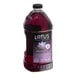 A bottle of Lotus Plant Energy Purple Lotus 5:1 Energy Concentrate with purple liquid inside.