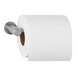 A roll of toilet paper on a metal holder.