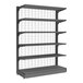 A grey Wanzl Wire Tech single-sided gondola shelving unit with wire mesh shelves.