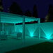 A white patio with gray Ape Labs Coin 2.0 LED lights set to blue.