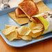A sandwich and Lay's Baked Original Potato Chips on a tray.