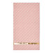 A Sophistiplate paper guest towel with pink and white stripes and a gold stripe.