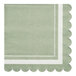 A green Sophistiplate paper cocktail napkin with a white scalloped edge.