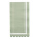 A green Sophistiplate paper guest towel with scalloped edges and white trim.