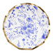 A Sophistiplate wavy paper salad plate with a blue and white floral design and gold trim.