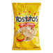 A yellow bag of Tostitos Bite Size Rounds tortilla chips.