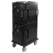 A black plastic Cambro Ultra Camcart with a door on wheels.