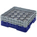 A navy blue plastic Cambro glass rack with clear plastic cups inside.