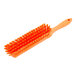 An orange Carlisle Sparta counter brush with orange bristles.