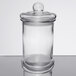 A Libbey clear glass jar with a lid.