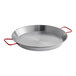 A Matfer Bourgeat polished carbon steel paella pan with red handles.
