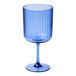 A Sophistiplate cobalt blue plastic wine glass with a stem.