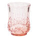 A Sophistiplate blush pink plastic tumbler with a star design.