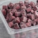 A plastic container of Pitaya Foods organic unsweetened acai berry bite-sized pieces.