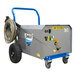 A Delco portable hot/cold water pressure washer machine with a hose attached.