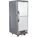 A gray Metro C5 heated holding and proofing cabinet with solid Dutch doors on wheels.