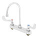 A chrome T&S deck-mounted workboard faucet with gooseneck spout and wrist action handles.