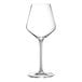 A close-up of a clear Chef & Sommelier wine glass with a long stem.