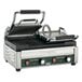 A Waring Panini Grill with grooved top and bottom plates on a counter.
