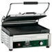 A Waring Panini Supremo grill with a black and green handle.