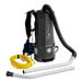 A Lavex backpack vacuum with a hose and attachment connection.