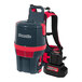 A red and black NaceCare Solutions cordless backpack vacuum with a battery pack and tool kit.