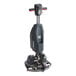 A NaceCare Solutions cordless walk behind floor scrubber with a red handle.