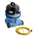 A blue NaceCare wet/dry vacuum with a black top and a yellow cable.